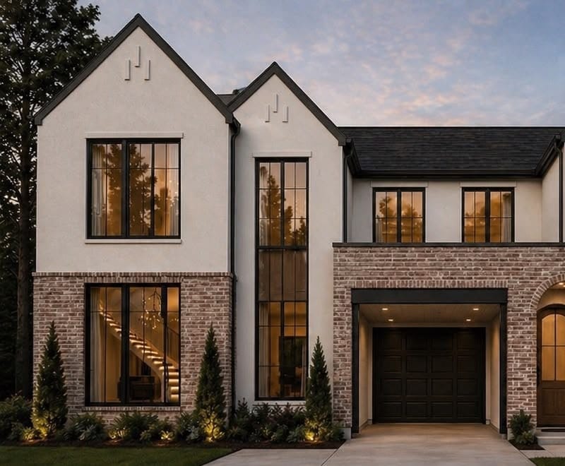 Two-story brick and stucco custom residence at dusk, Dallas, Texas